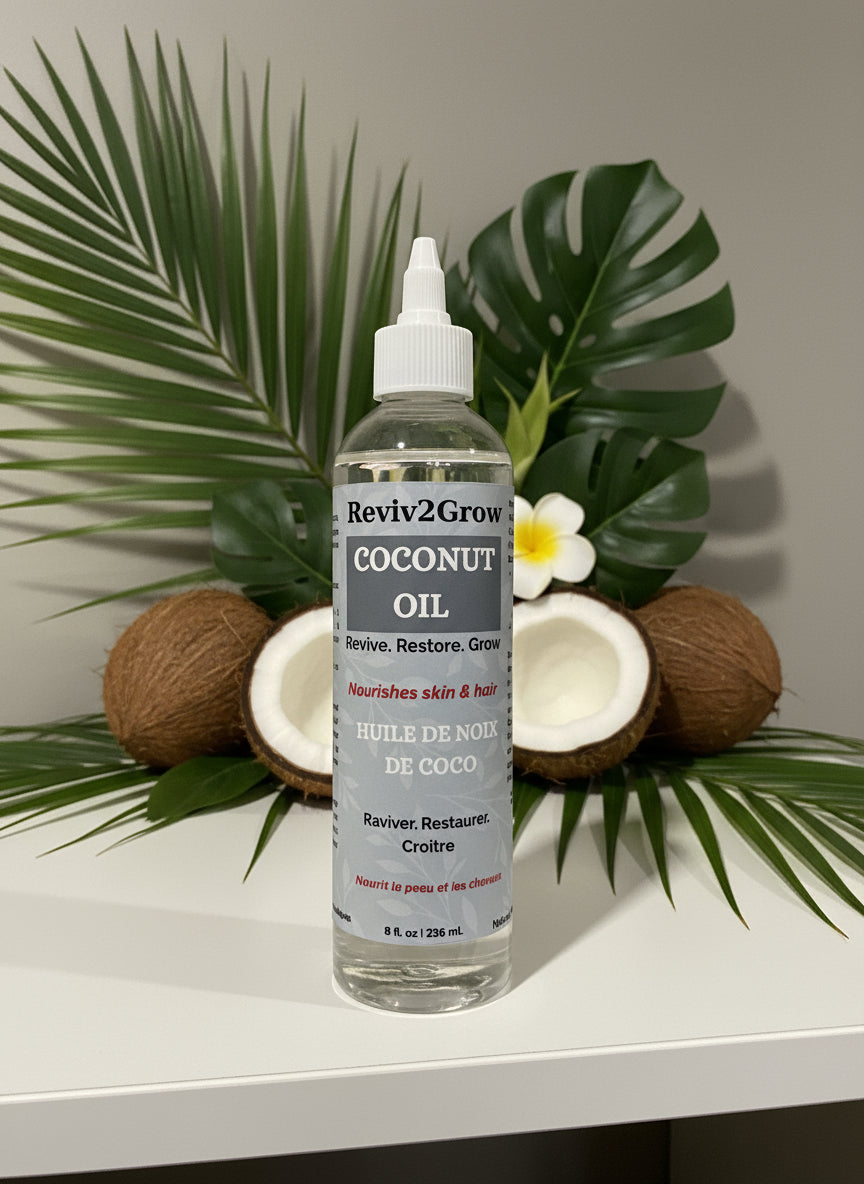 Coconut oil bottle labeled 'Revive & Grow' on a white surface