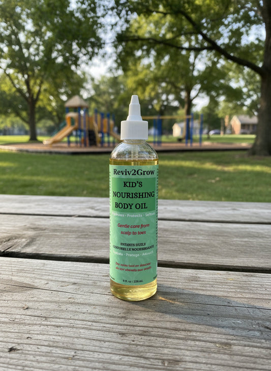 Bottle of Reviv2Grow Kid's Nourishing Body Oil on a neutral background