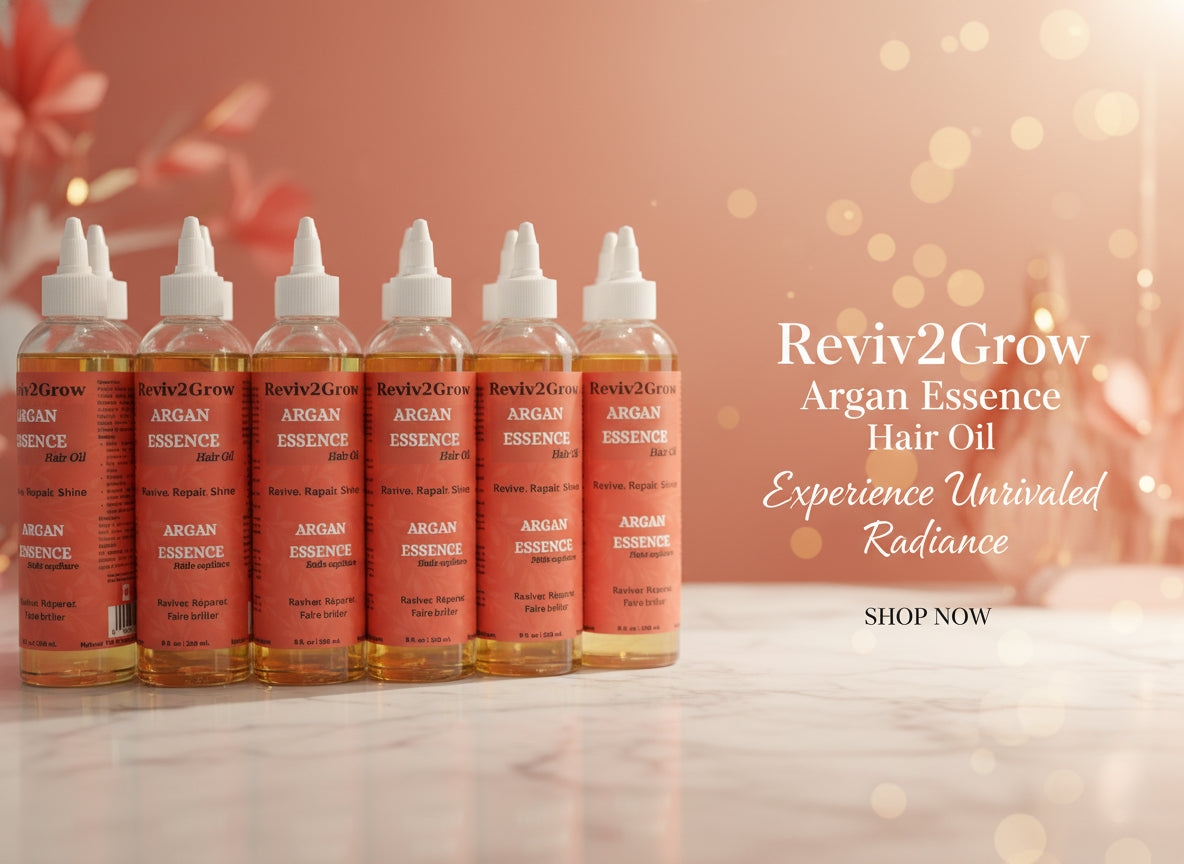 Multiple bottles of Reviv2Grow Argan Essence Hair Oil on a shelf.