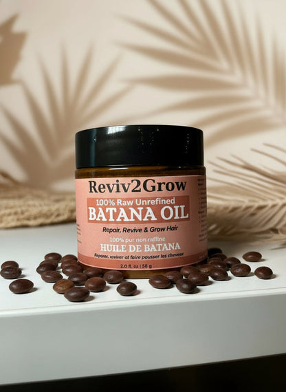 Jar of Reviv2Grow Batana Oil on a white surface