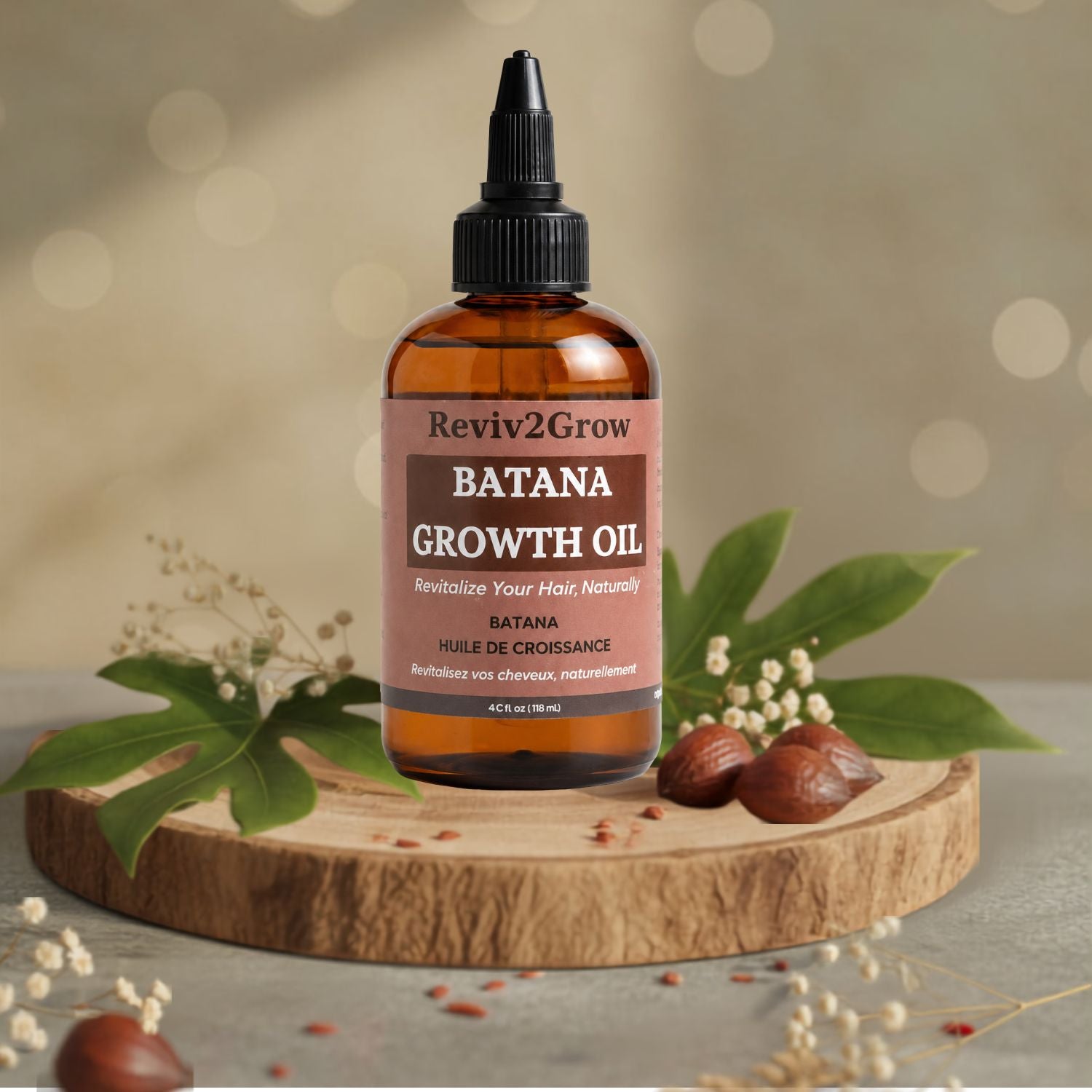 Bottle of Reviv2Grow Batana Growth Oil on a light background
