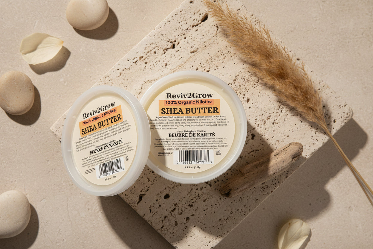 Two containers of Reviva2Grow Shea Butter on a textured surface with decorative elements.