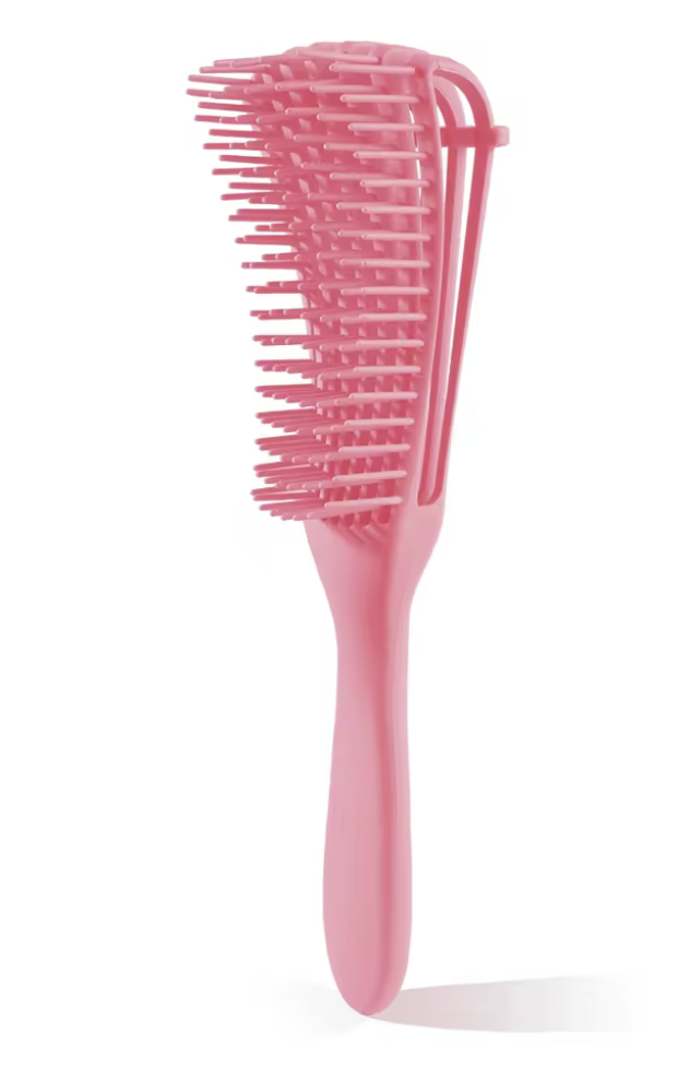 Pink hairbrush on a white background