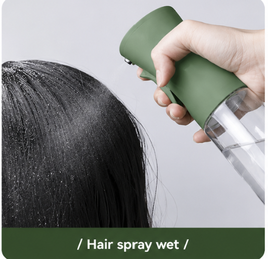 Person using a green hair spray bottle on wet hair with a plain background