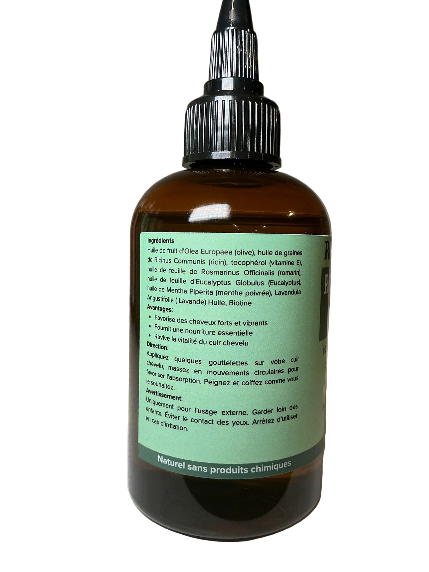 Brown glass bottle with green label on a white background